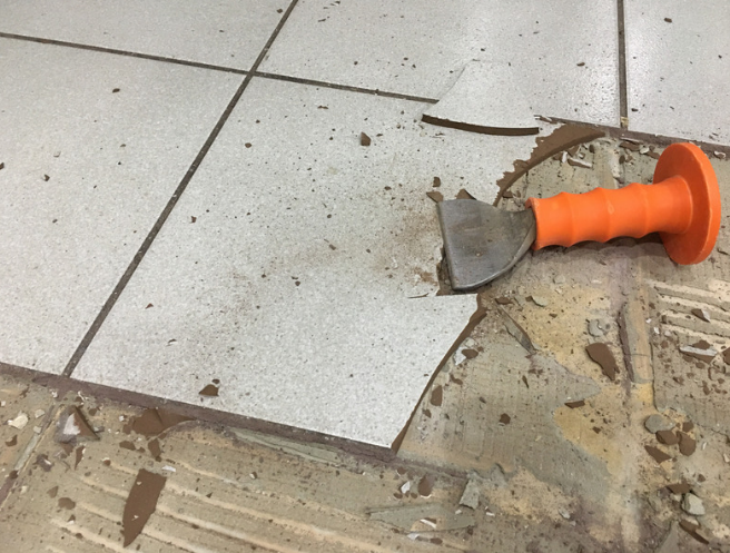 REMOVING TILE FLOORING WITH A CHISEL